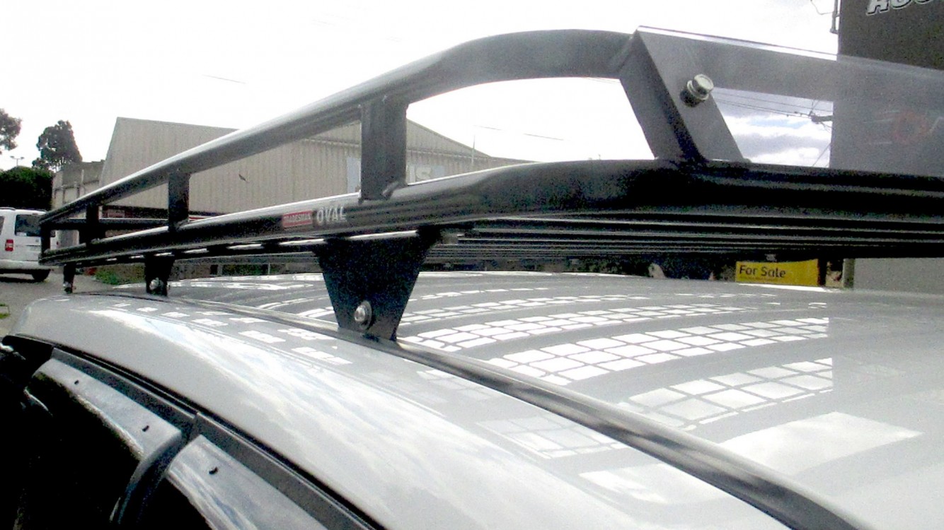 Mitsubishi Pajero with Oval Steel roof rack with custom mounts