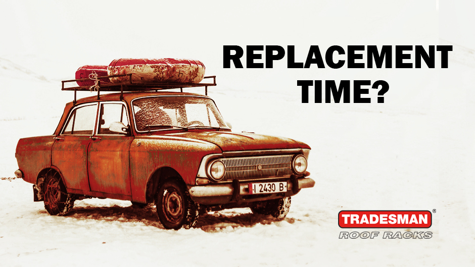Old car in a very dilapidated state with a very basic roof rack on the roof and heading text "Replacement time?"