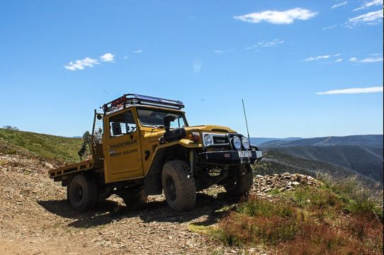 Side view of LandCruiser 47 Series parked on a track in the Victorian high country.