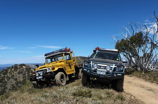 Toyota LandCruiser 47 Series parked beside a Ford Ranger on a track high in the Victorian high country.